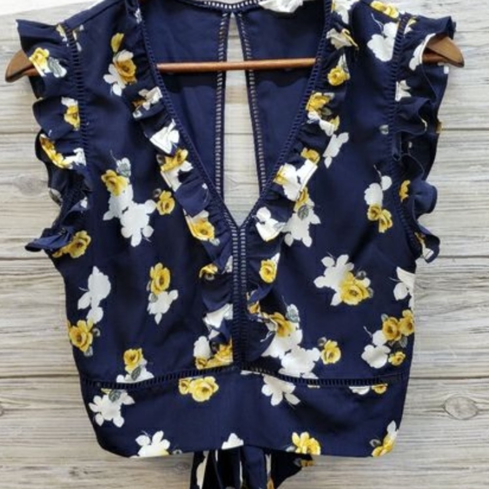 Blue shirt with yellow flowers ties in back